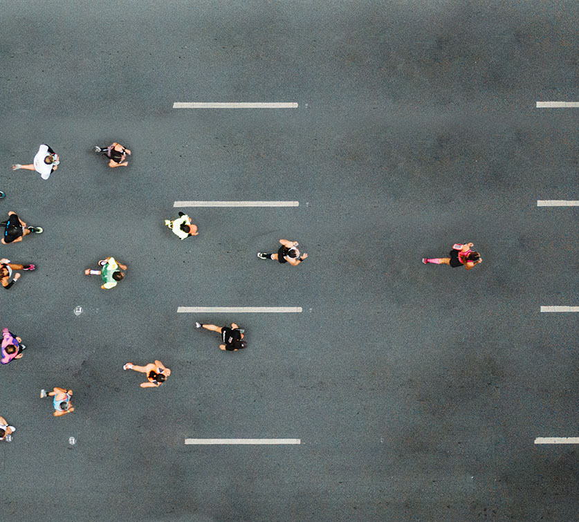 Group of runners with a leader at the front