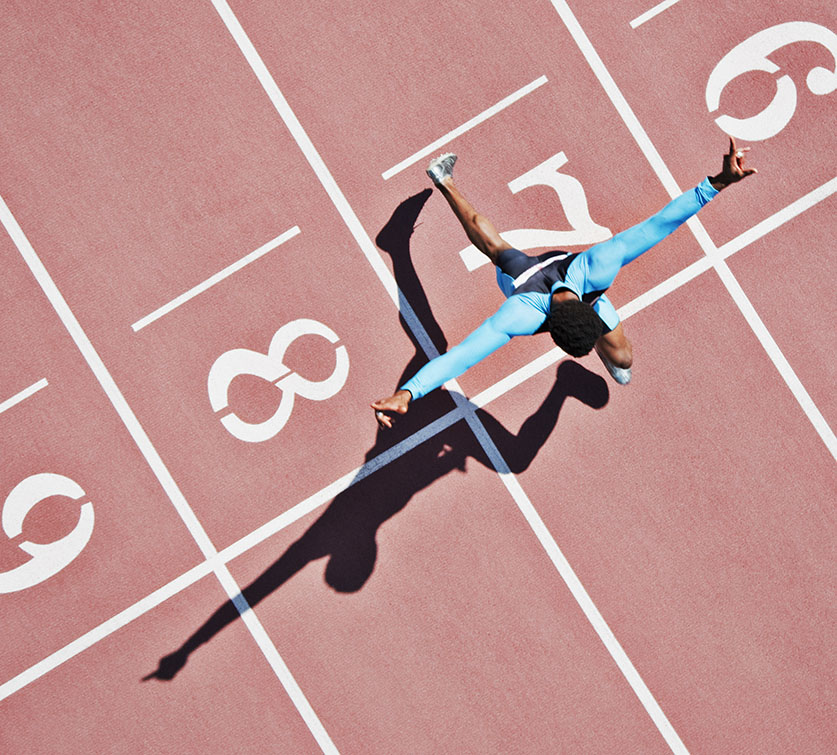 Runner crossing the finish line triumphantly